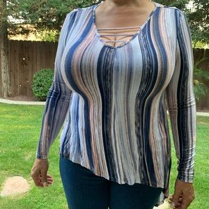 Jennifer Lopez striped asymmetrical shirt